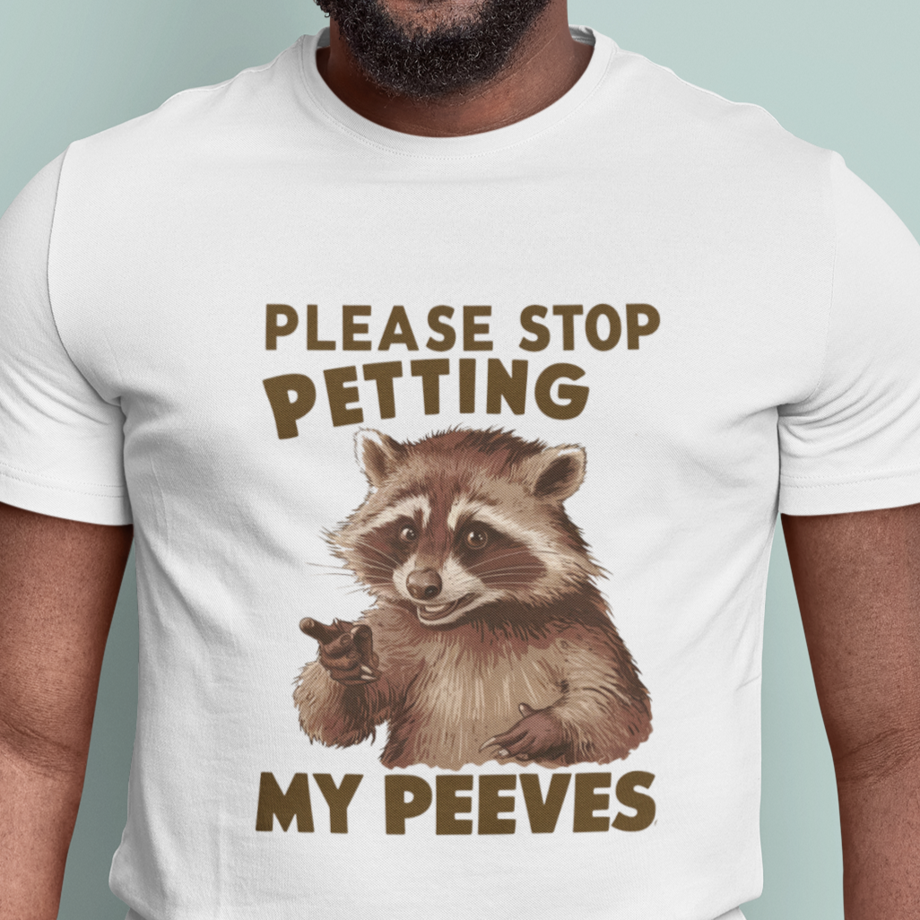 humorous raccoon graphic tee with the text 'Stop Petting My Peeves', perfect for those who embrace their quirks and individuality