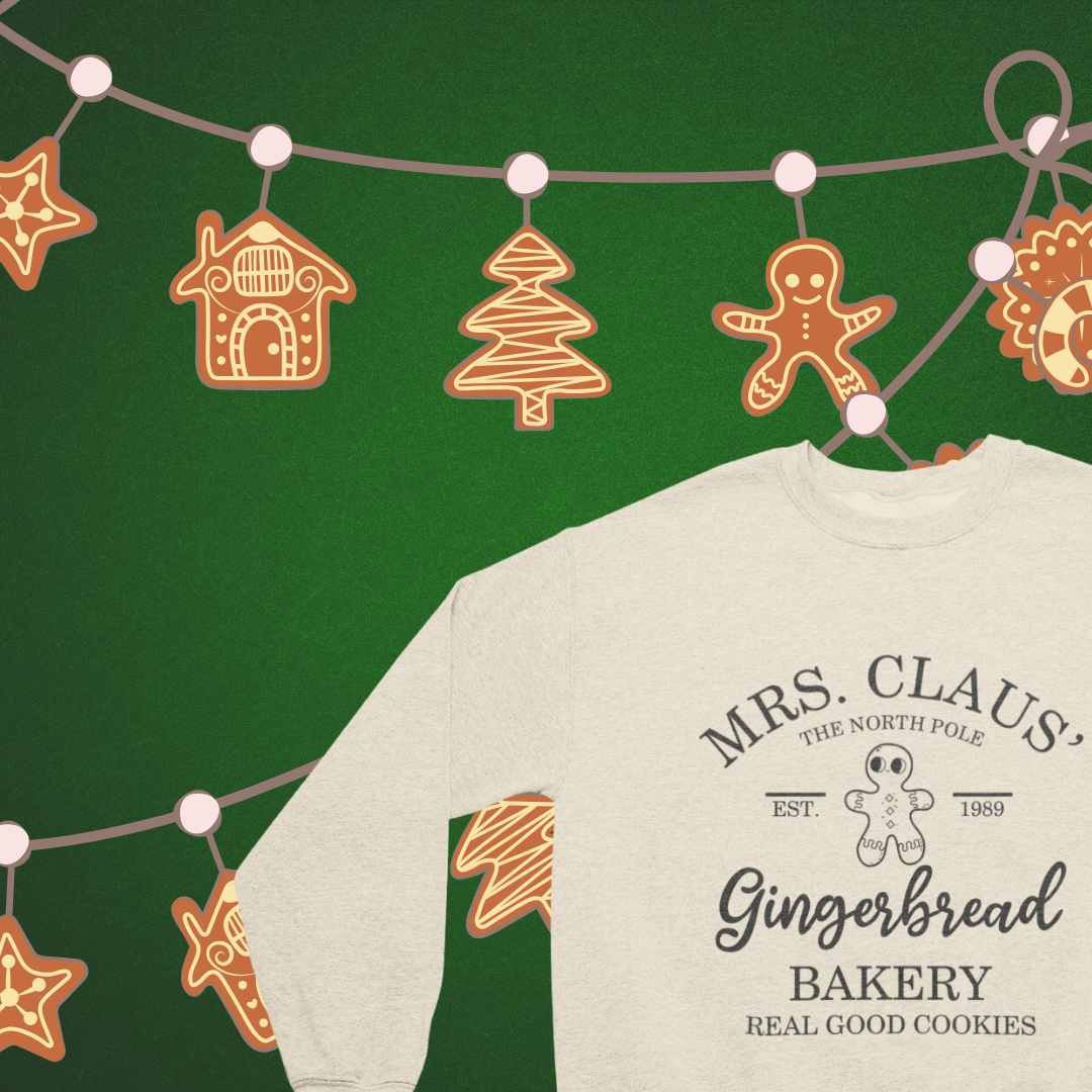 "Mrs. Claus Gingerbread Bakery crew neck sweatshirt in festive red featuring an adorable bakery graphic."
