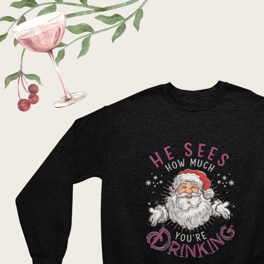 "Close-up of the playful graphic on the He Sees How Much You’re Drinking Crew Neck sweatshirt."