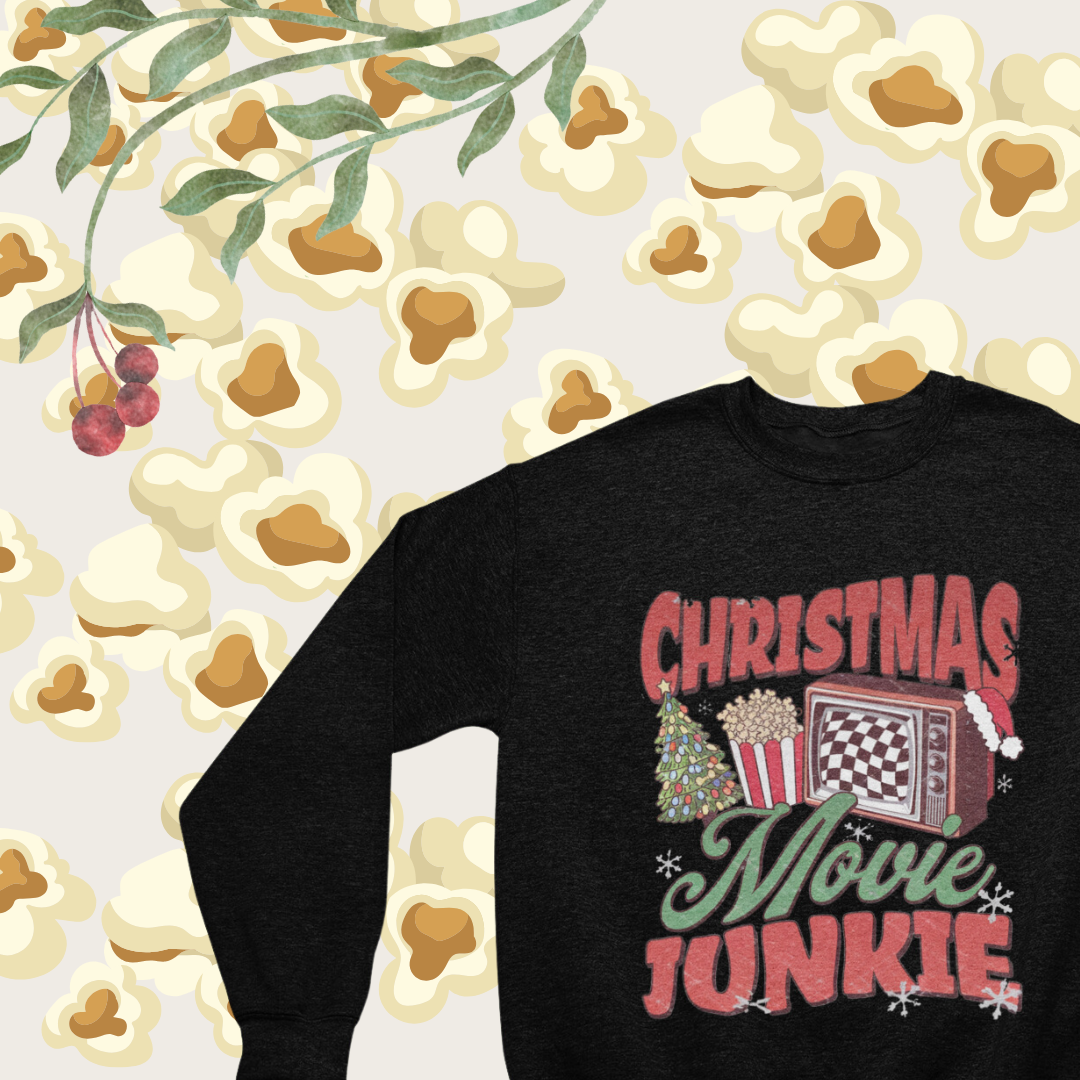 "Close-up of the playful 'Christmas Movie Junkie' design on a cozy crew neck sweatshirt."
