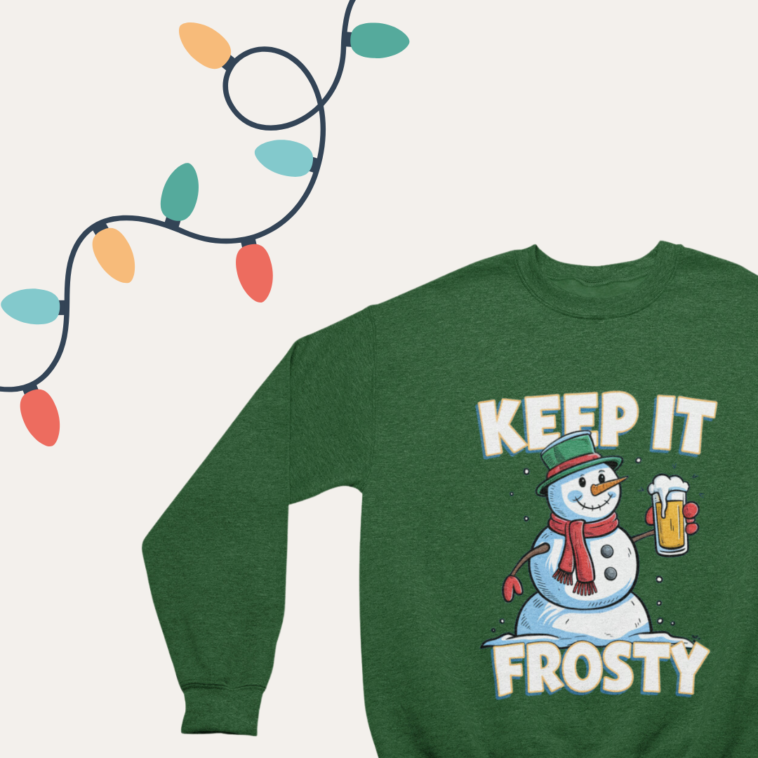 Close-up of the 'Keep It Frosty' text on a cozy crewneck sweatshirt with a snowman