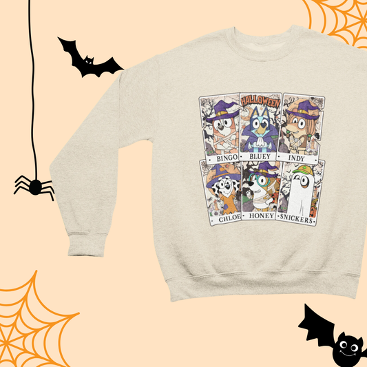 a white sweater with halloween images on it