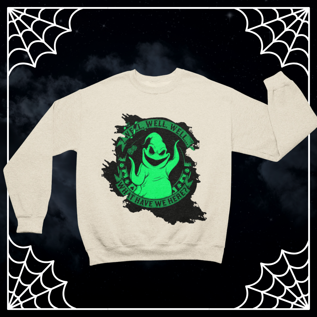 a white sweater with a green alien on it