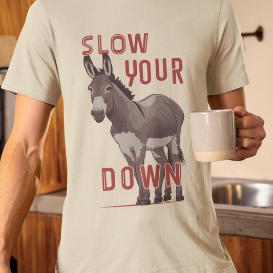 White T-shirt with humorous 'Slow Your Ass Down' slogan and donkey graphic, perfect for funny gifts and casual wear