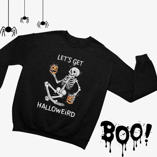 a black sweater with a skeleton holding a pumpkin