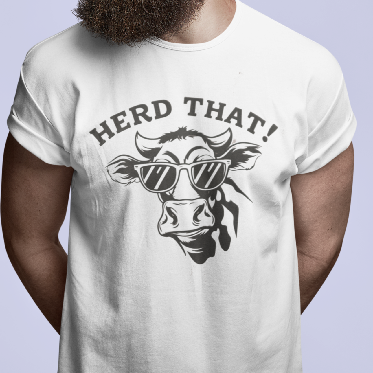 "Herd That T-Shirt - Black unisex cotton tee featuring a humorous 'Herd That' cow pun design, perfect for farmers and agricultural enthusiasts."