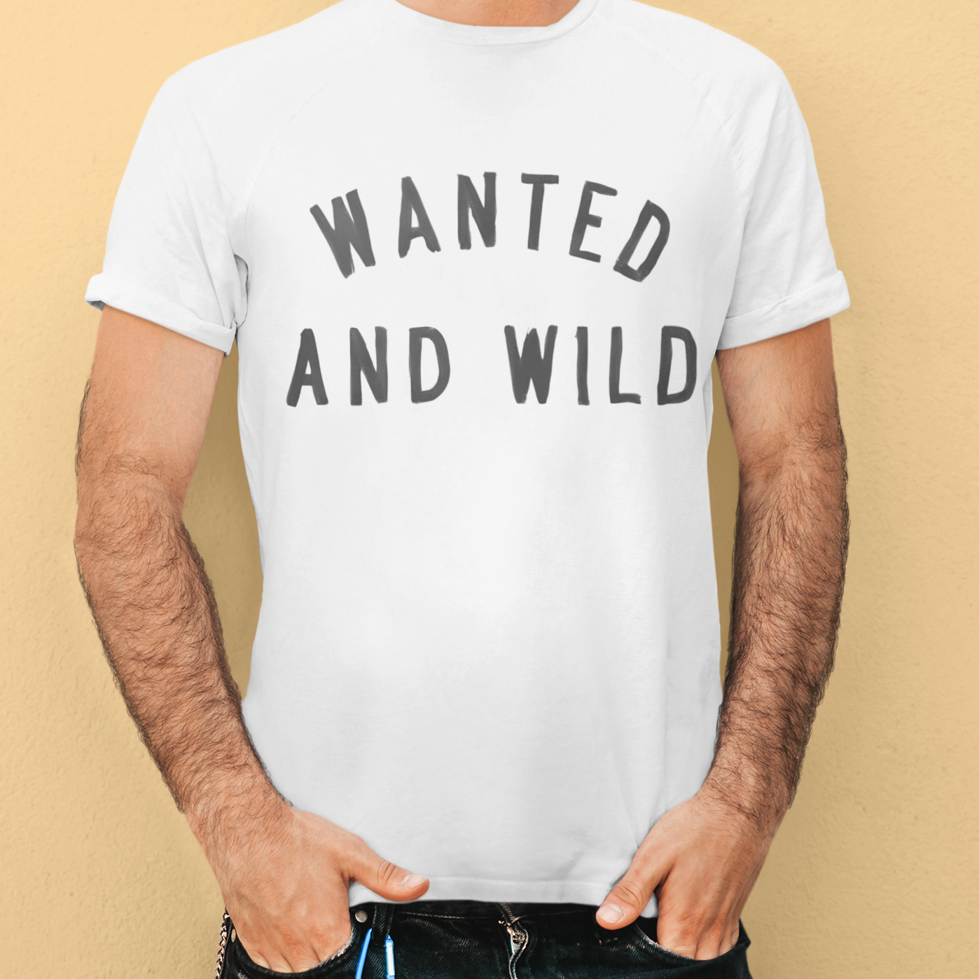 "Wanted and Wild T-Shirt - Black unisex cotton tee featuring a vintage western cowboy graphic with 'Wanted and Wild' typography, perfect for cowboy enthusiasts and western heritage fans."