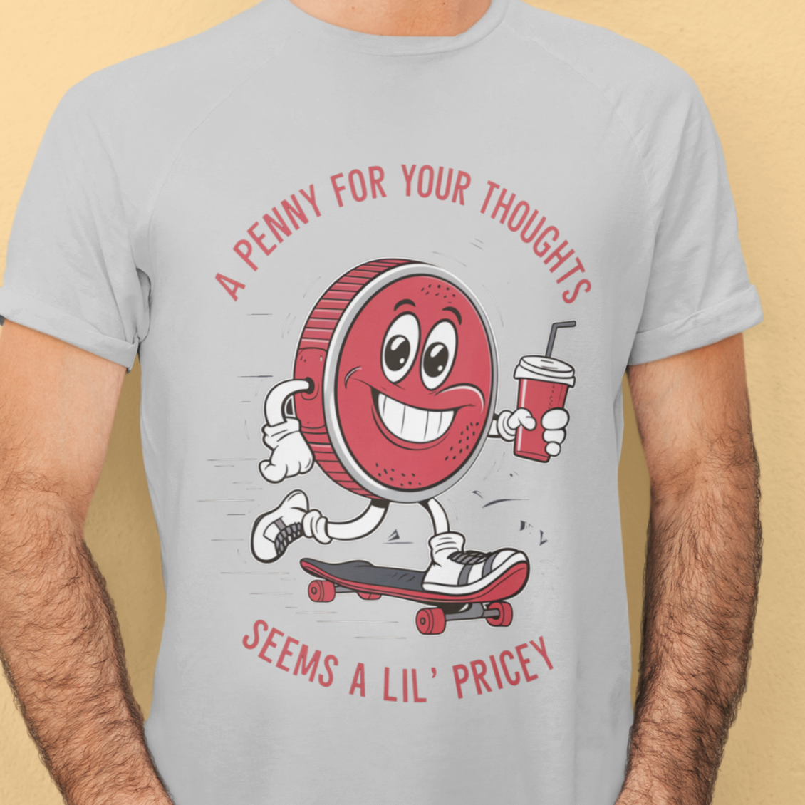 White t-shirt with humorous text 'Penny for Your Thoughts' in bold, playful font