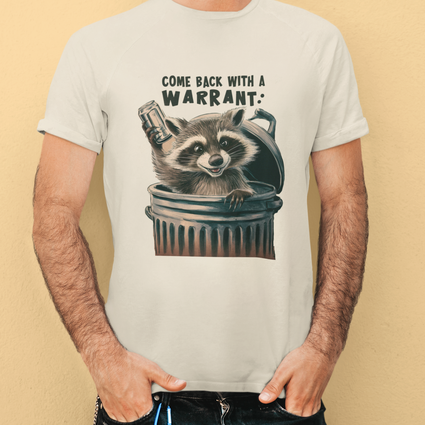 "Come Back with a Warrant Raccoon T-Shirt - Gray unisex cotton tee featuring a humorous graphic of a raccoon with the text 'Come Back with a Warrant,' perfect for wildlife enthusiasts and animal lovers."