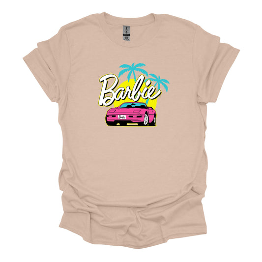 **Alt Text:** Barbie Corvette T-Shirt with a graphic of Barbie's iconic pink Corvette. Stylish and fun, perfect for Barbie fans of all ages. Made from high-quality, comfortable cotton, available in multiple sizes.